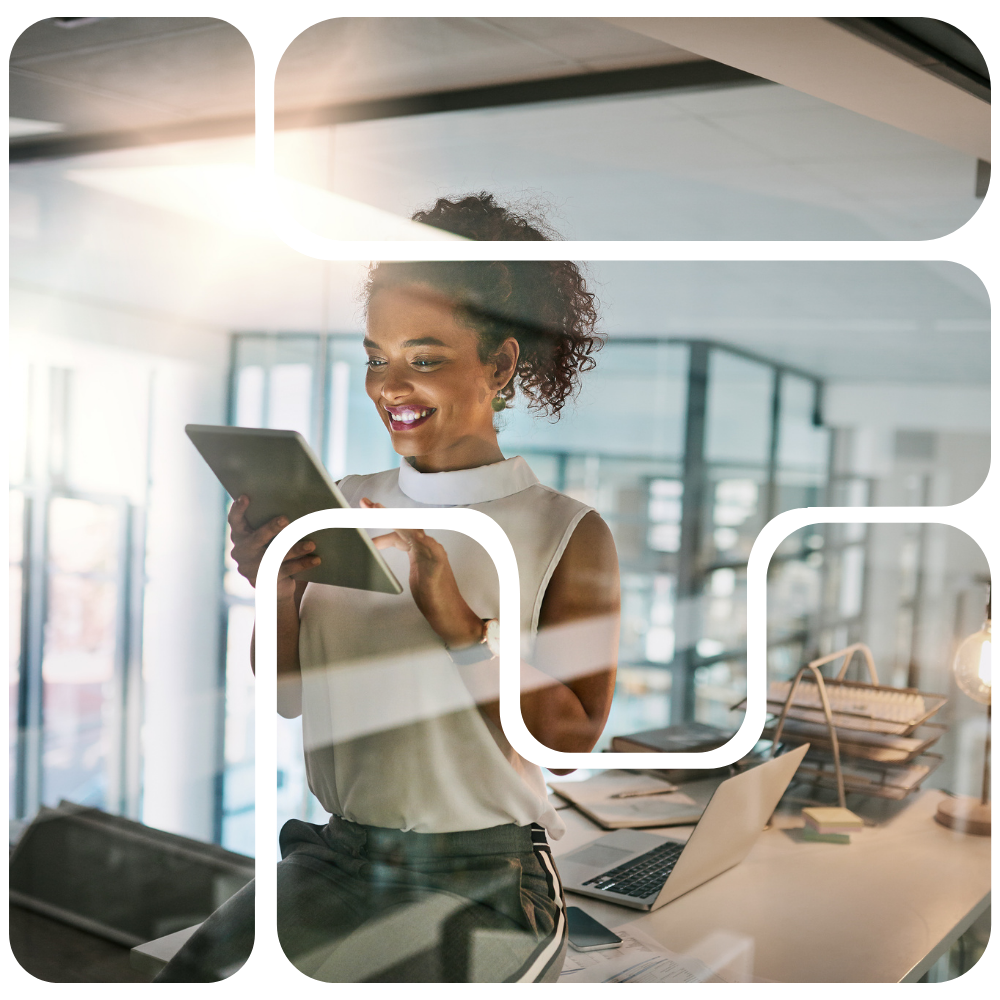 woman in office looking at a tablet